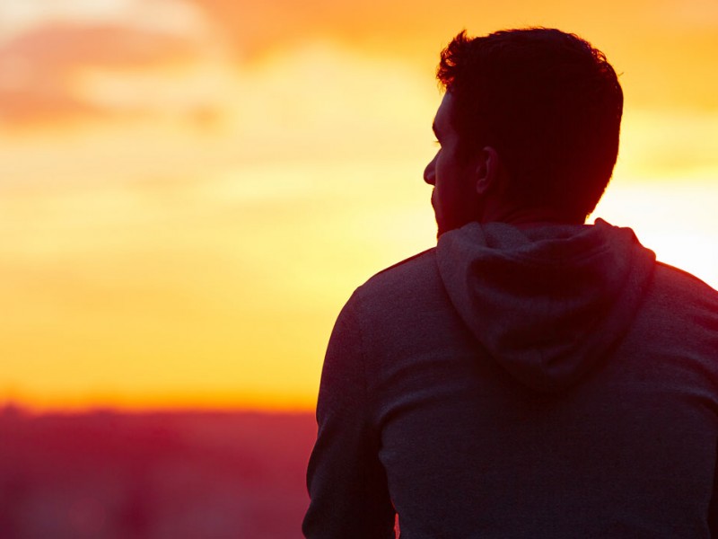 man silhouette against sunset